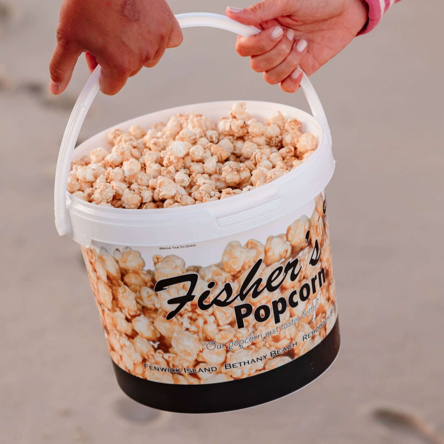 A tub of Fisher's Popcorn being carried along the beach in Ocean City MD
