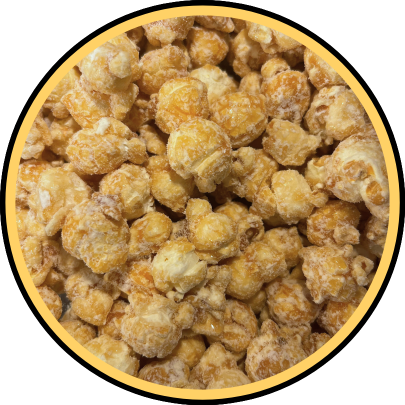 A close-up of Fisher's Popcorn Caramel Dusted w/ White Cheddar shows golden popcorn coated in caramel and lightly dusted with savory white cheddar inside a circular yellow-and-black frame.