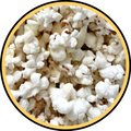 Close-up of freshly popped white popcorn in a yellow and black circular border, perfect for Fisher's Popcorn White Cheddar bundle.
